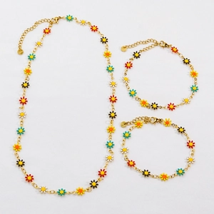 Golden stainless steel jewelry set featuring colorful daisy charms with lobster clasps
