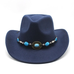 Detail of navy blue wool cowboy hat with turquoise beads and vintage metal emblem buckle