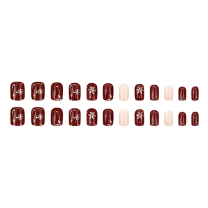 Deep red and glitter Christmas press-on nails set with golden snowflake and star patterns
