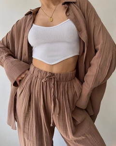 Detailed texture of coffee linen shirt and high waist drawstring pants set with ribbed vest