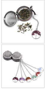 Detail of tree of life charm with colorful natural stones on stainless steel tea infuser
