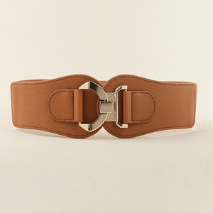 Detailed view of wide brown elastic belt with minimalist gold geometric metal buckle