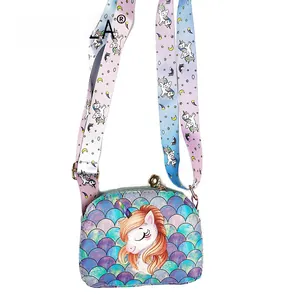Macro detail of unicorn child crossbody bag with colorful scale pattern and wide strap