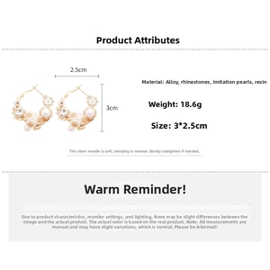 Detail view of flower pearl hoop earrings with crystal inlay and dimensions of 3x2.5cm