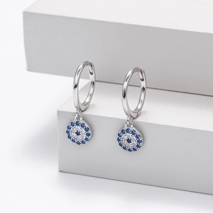 Detail shot of S925 sterling silver evil eye hoop earrings with blue and white zircons