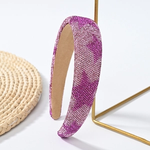 Detail of premium purple rhinestone headband showing high-density crystal craftsmanship