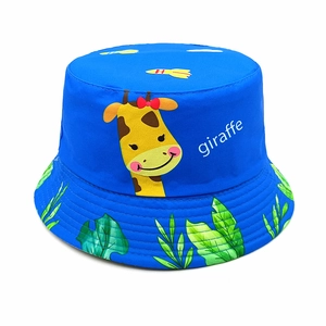 Close-up of blue cotton kids sun hat with giraffe print and tropical leaf brim detail
