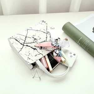 Elegant white marble pattern handbag with pink silk scarf and spacious interior storage