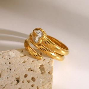 Detailed view of golden heart zircon ring with double-layered cross band on stone