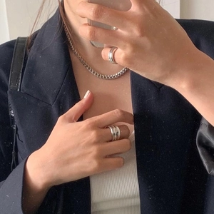 Minimalist 925 sterling silver double-layer rings and chain necklace worn with dark suit