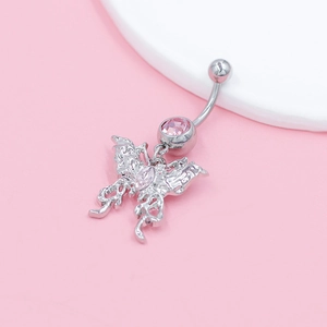 Detail of silver butterfly belly ring with pink gems on a soft pink and white background
