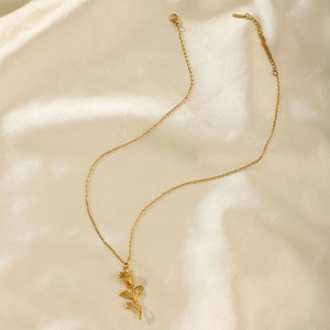 Elegant 18K gold plated 3D rose flower pendant necklace on soft beige silk background