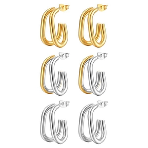 Close-up of oval double-layered hoop earrings in gold, silver, and two-tone finishes