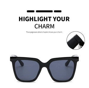 Detail of square oversized sunglasses with reinforced hinges and glossy black frame