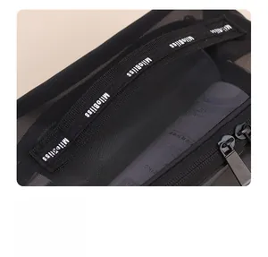 Detail of black mesh makeup bag featuring a reinforced carrying handle and smooth zipper