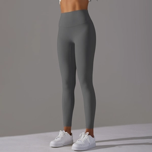 Close-up of high-waisted seamless dark grey yoga leggings with body-sculpting lines