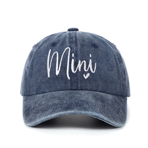 Detail of Mini embroidery and heart on a washed dark blue denim baseball cap for kids