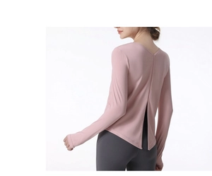 Detailed back view of a pink long-sleeve sports shirt featuring a stylish deep V-slit design
