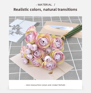 Close-up of artificial Persian Buttercup bouquet with realistic pink gradient petals