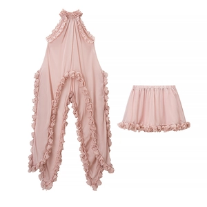 Pink chiffon two-piece set with ruffled halter top and matching skirt for vacation