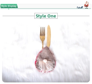 Close-up of a festive Christmas gnome cutlery holder in red and white plaid fabric