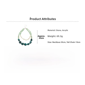Detailed view of double layered beaded necklace with green stones and acrylic pebbles