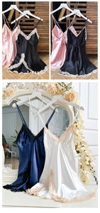 Detailed view of satin nightgown featuring deep V-neck lace and silky fabric textures