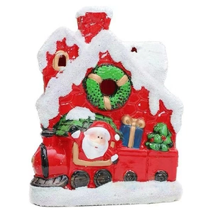 Christmas ceramic mini red house and train ornament with faux snow on white background