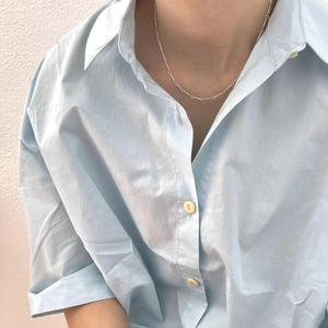 Minimalist 925 sterling silver twisted chain necklace worn on collarbone for women