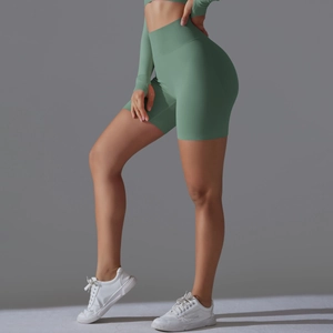 Close-up of seamless high-waisted yoga shorts in sage green with ribbed waistband