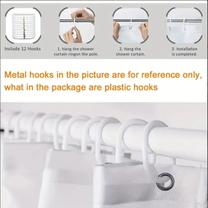 Detailed view of 12 white plastic curtain hooks for easy installation on shower rods
