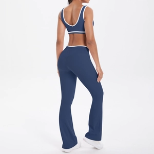 Two-piece yoga set with U-back sports bra and navy blue flared leggings with white trim