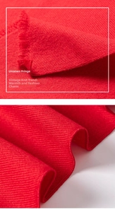 Close-up detail of high-quality red knit scarf featuring elegant frayed fringe trim
