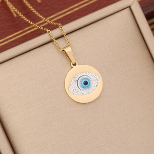 Double-layered gold stainless steel necklace with blue evil eye pendant and zircon accents