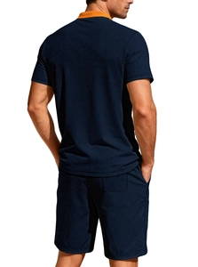 Detailed back view of men's navy polo set with orange collar and waffle knit texture