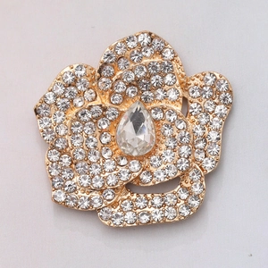 Sparkling camellia flower brooch with gold plating and white crystal rhinestones
