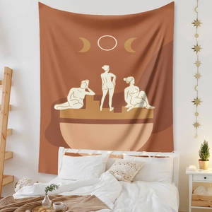 Detail of bohemian tapestry featuring abstract female silhouette and moon phase patterns