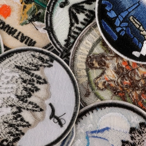 Set of round embroidered mountain patches for outdoor apparel with high-density stitching