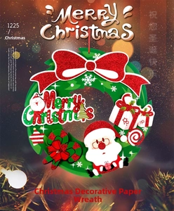 Close-up of paper Christmas wreath with glittery Santa Claus, bow and Merry Christmas sign
