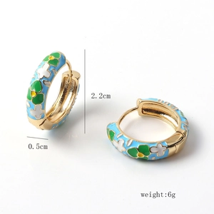 Detailed view showing 2.2cm diameter golden hoop earrings with colorful floral enamel