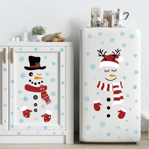 Christmas snowman and reindeer fridge decals with blue snowflakes on white cabinets