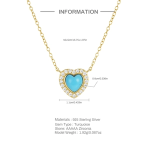 Close-up of heart turquoise pendant with 925 silver gold plating and zircon details