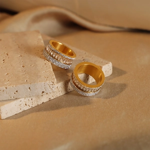 French style multi-layer 18k gold plated ring with zircon stones on a stone base