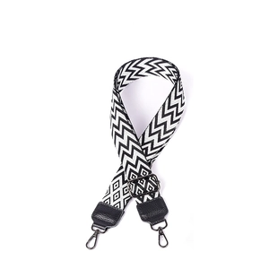 Detail of adjustable 38mm woven shoulder strap with black and white chevron pattern