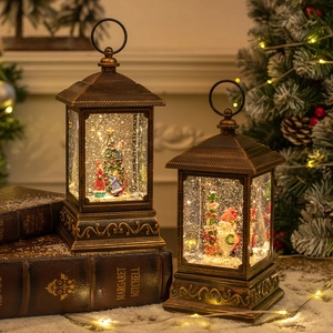 Vintage bronze Christmas snow globe lanterns with warm LED light and swirling glitter