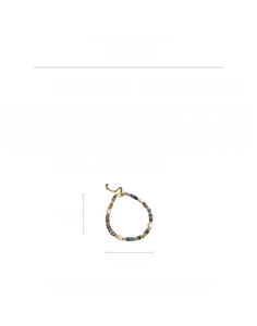 Detail view of 18K gold plated bracelet with colorful stones and baroque pearls
