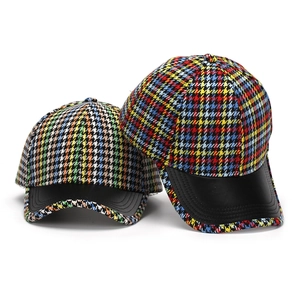 Colorful houndstooth baseball cap with black leather brim in front and side views