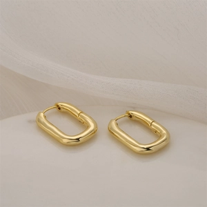 Minimalist rectangular hoop earrings in 14K gold plating with polished finish