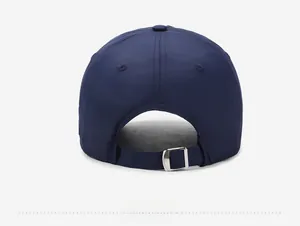 Detail of the dark blue quick-dry sun hat showing the adjustable metal buckle closure