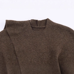 Dark brown chunky knit sweater vest with cozy wool texture and detailed crewneck seams